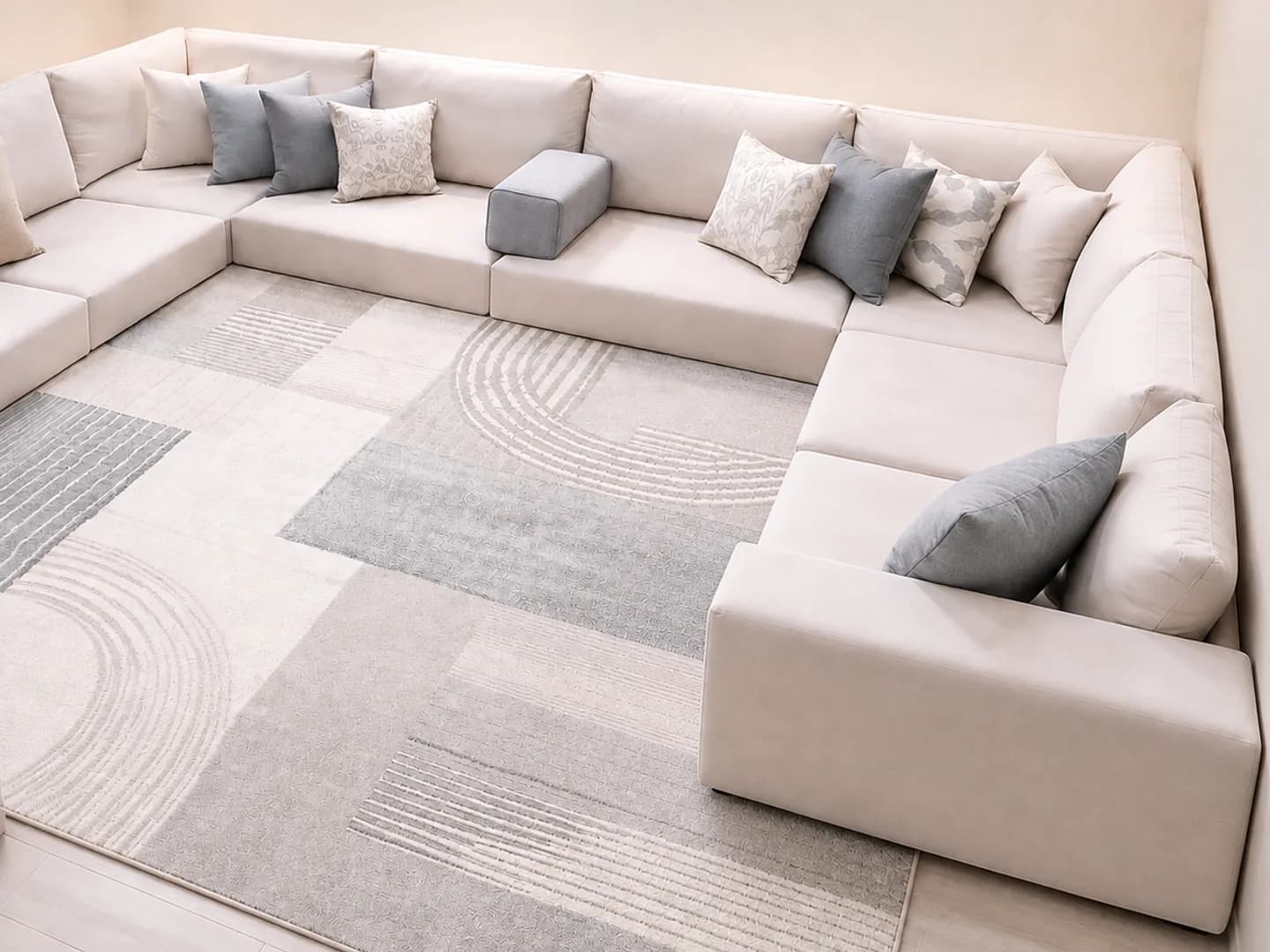 Large cream floor cushion sofa in a bright living room