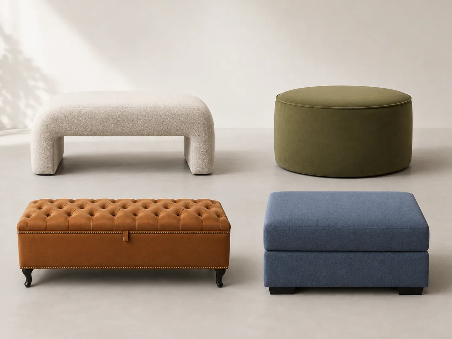 Four custom upholstered ottomans in different shapes and fabrics